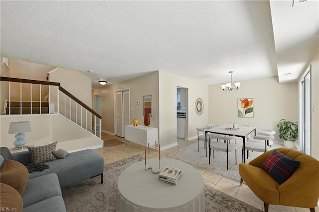 569 Chancery Ln, Virginia Beach, VA 23452 - living area with stairs, light tile patterned floors, a chandelier, and a textured ceiling