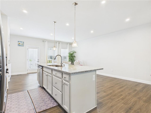 1732 Defiance Dr, Chesapeake, VA 23323 - kitchen with a kitchen island with sink, dark wood finished floors, stainless steel dishwasher, recessed lighting, and light stone counters