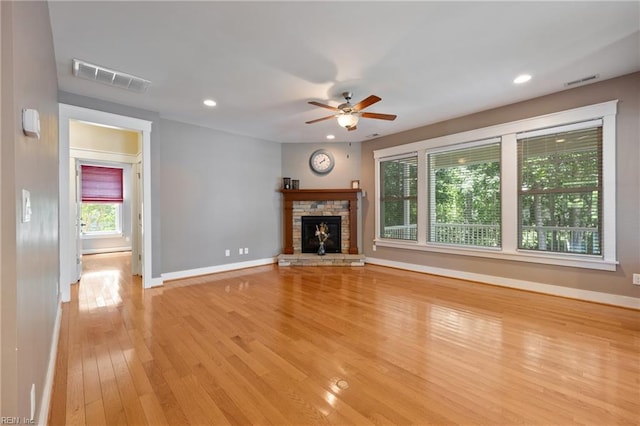 102 Batten Cv, Carrollton, VA 23314 - unfurnished living room with light wood-style floors, a ceiling fan, a fireplace, and recessed lighting