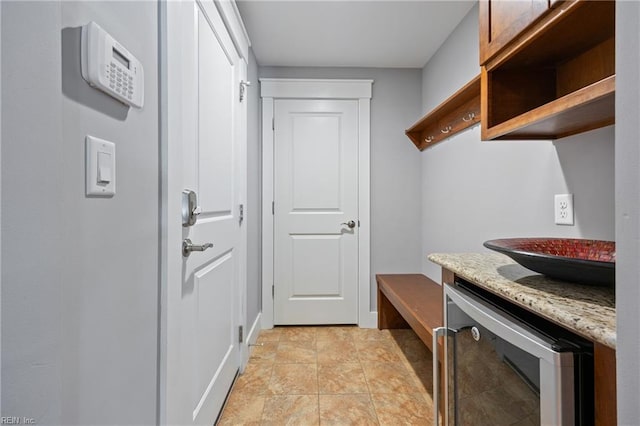 102 Batten Cv, Carrollton, VA 23314 - mudroom featuring wine cooler and light stone finish flooring