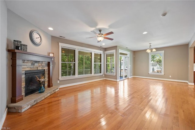 102 Batten Cv, Carrollton, VA 23314 - unfurnished living room featuring a stone fireplace, a ceiling fan, light wood finished floors, and recessed lighting