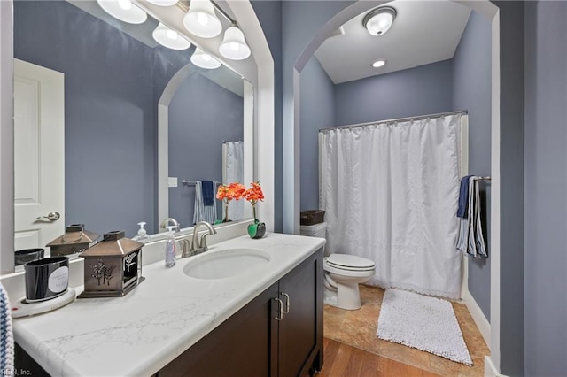 102 Batten Cv, Carrollton, VA 23314 - bathroom with vanity, wood finished floors, and a shower with curtain