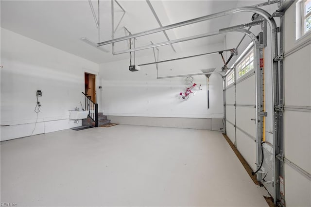 102 Batten Cv, Carrollton, VA 23314 - garage with a garage door opener and a sink