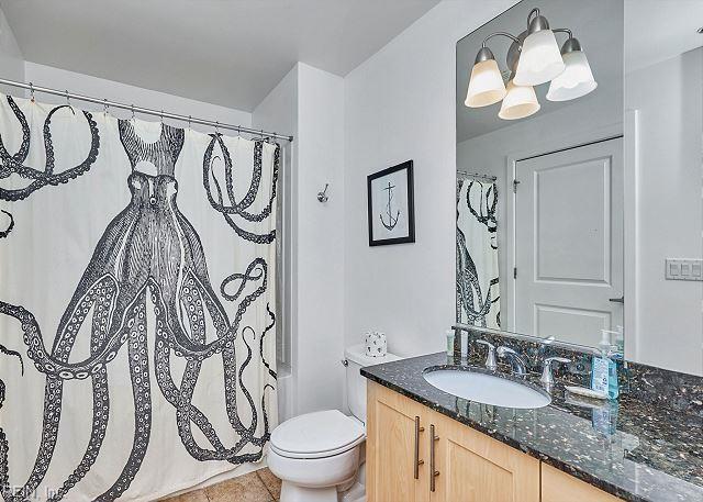 3738 Sandpiper Rd Unit 214B, Virginia Beach, VA 23456 - bathroom featuring vanity, tile patterned flooring, and a chandelier