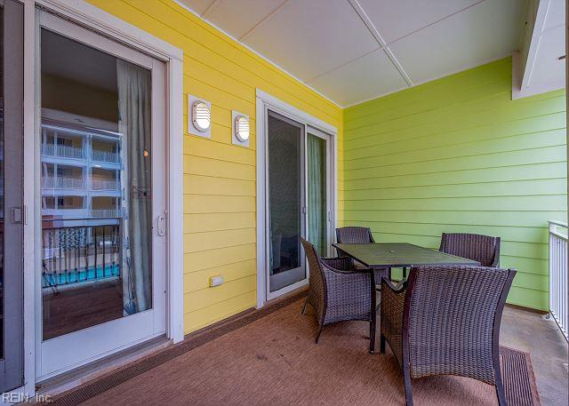 3738 Sandpiper Rd Unit 214B, Virginia Beach, VA 23456 - view of patio featuring outdoor dining area