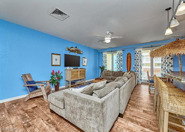 3738 Sandpiper Rd Unit 214B, Virginia Beach, VA 23456 - living area featuring wood finished floors and a ceiling fan
