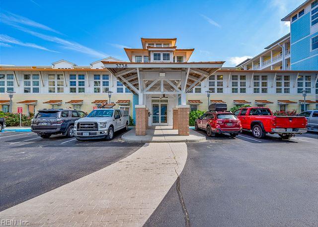3738 Sandpiper Rd Unit 214B, Virginia Beach, VA 23456 - view of building exterior featuring uncovered parking
