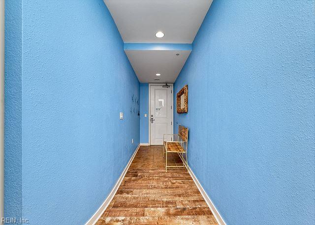 3738 Sandpiper Rd Unit 214B, Virginia Beach, VA 23456 - hall featuring a textured wall, wood finished floors, and recessed lighting