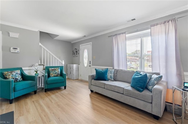 2025 Allison Dr, Chesapeake, VA 23325 - living room featuring light wood-style floors, stairs, ornamental molding, and a wainscoted wall