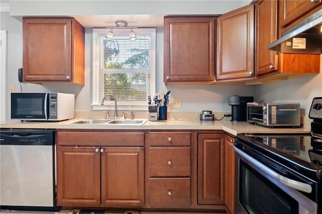 2025 Allison Dr, Chesapeake, VA 23325 - kitchen featuring stainless steel appliances, under cabinet range hood, light countertops, and brown cabinets