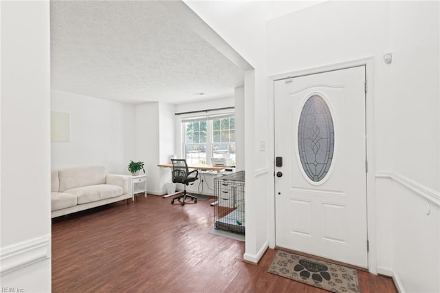 730 Kings Ridge Dr, Newport News, VA 23608 - foyer with wood finished floors and a textured ceiling