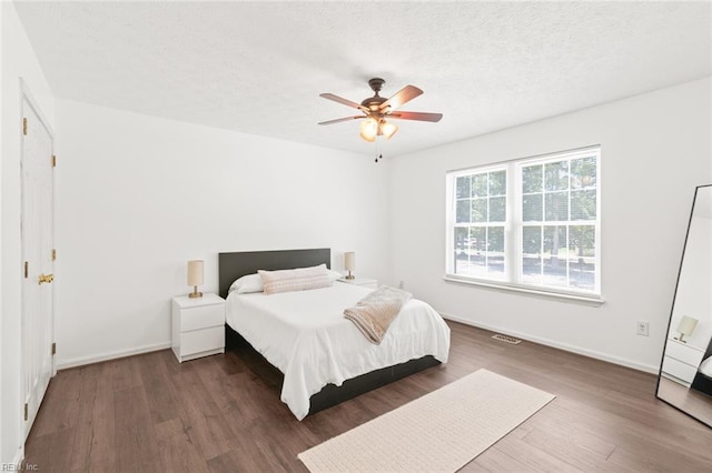 730 Kings Ridge Dr, Newport News, VA 23608 - bedroom featuring wood finished floors, a textured ceiling, and ceiling fan
