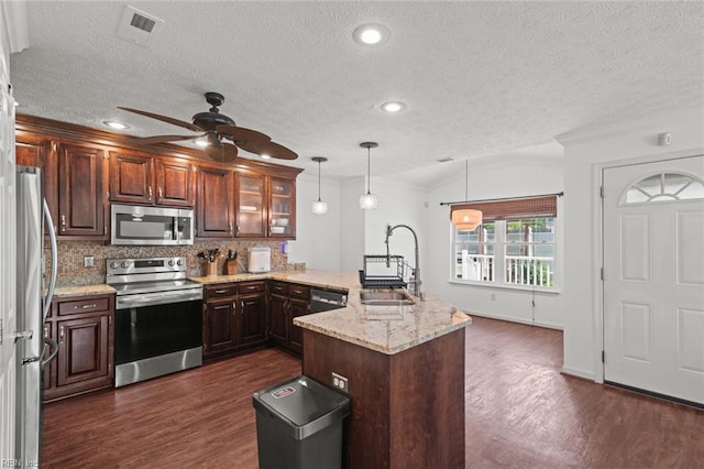 730 Kings Ridge Dr, Newport News, VA 23608 - kitchen with stainless steel appliances, a peninsula, a ceiling fan, dark wood-style flooring, and crown molding