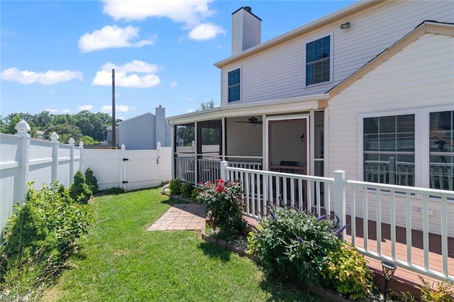 730 Kings Ridge Dr, Newport News, VA 23608 - rear view of house featuring a sunroom, a fenced backyard, ceiling fan, a chimney, and a gate