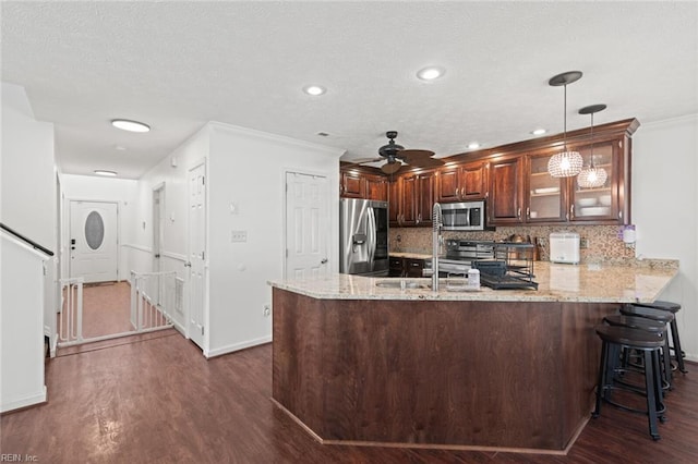 730 Kings Ridge Dr, Newport News, VA 23608 - kitchen featuring appliances with stainless steel finishes, a peninsula, dark wood-style flooring, glass insert cabinets, and light stone countertops