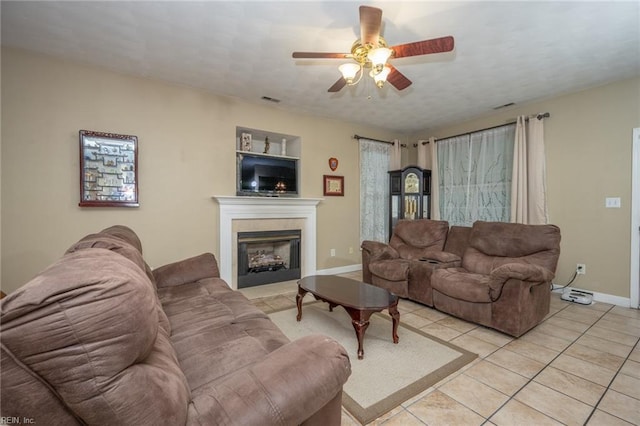 2146 Kingsley Ln, Chesapeake, VA 23323 - living area with light tile patterned floors, ceiling fan, and a tiled fireplace