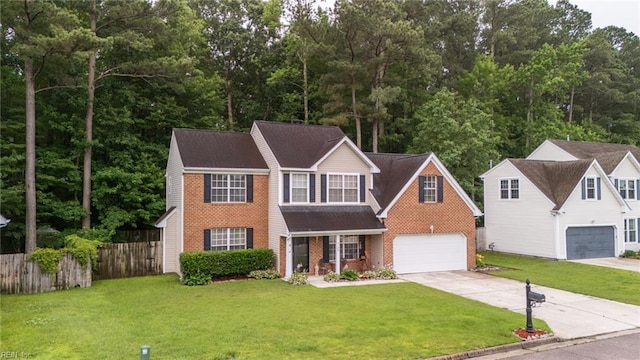 2146 Kingsley Ln, Chesapeake, VA 23323 - view of front of house featuring driveway, brick siding, a garage, and roof with shingles