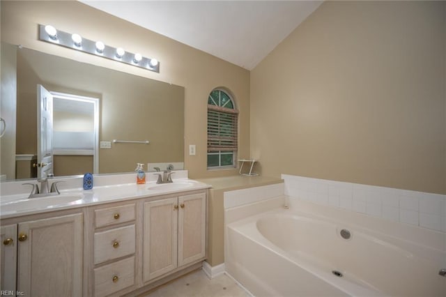 2146 Kingsley Ln, Chesapeake, VA 23323 - bathroom with a bath, double vanity, and vaulted ceiling