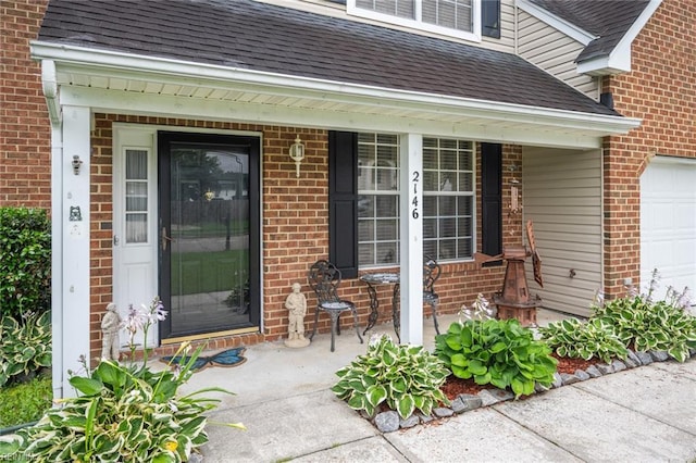 2146 Kingsley Ln, Chesapeake, VA 23323 - entrance to property featuring roof with shingles, a porch, brick siding, and a garage