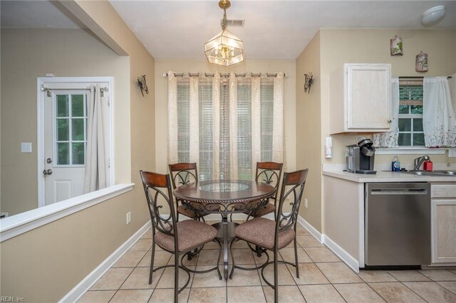 2146 Kingsley Ln, Chesapeake, VA 23323 - dining space with light tile patterned flooring and a chandelier