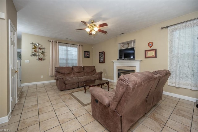 2146 Kingsley Ln, Chesapeake, VA 23323 - living area with light tile patterned floors, a ceiling fan, and a tile fireplace