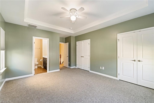 4371 Pickney Ln, Chesapeake, VA 23324 - unfurnished bedroom with two closets, carpet flooring, crown molding, ensuite bathroom, and a raised ceiling