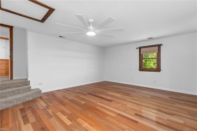 160 Outlaw Ln, Suffolk, VA 23435 - spare room with light wood-style flooring, ceiling fan, and stairs