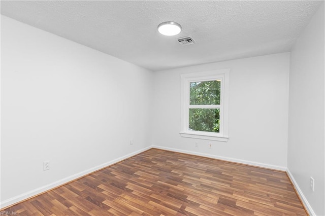 160 Outlaw Ln, Suffolk, VA 23435 - unfurnished room with wood finished floors and a textured ceiling