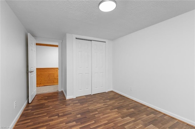 160 Outlaw Ln, Suffolk, VA 23435 - unfurnished bedroom featuring wood finished floors, a textured ceiling, and a closet