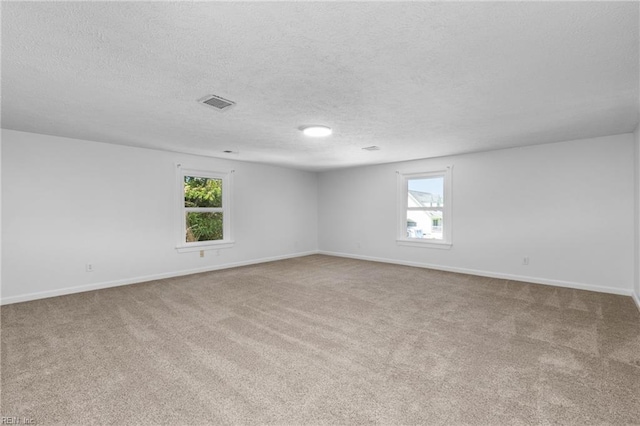 160 Outlaw Ln, Suffolk, VA 23435 - carpeted spare room with a textured ceiling and baseboards