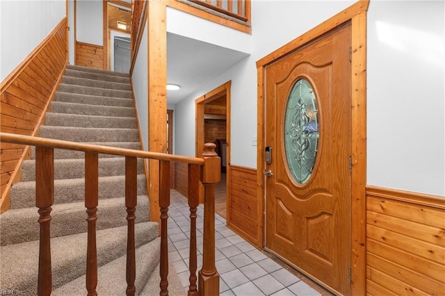 160 Outlaw Ln, Suffolk, VA 23435 - foyer entrance with a wainscoted wall, wood walls, light tile patterned floors, and stairs