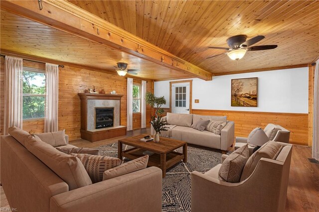 160 Outlaw Ln, Suffolk, VA 23435 - living area with ceiling fan, wood walls, a wooden ceiling with exposed beams, wood finished floors, and healthy amount of natural light