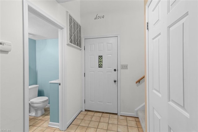 518 Spring Trce, Williamsburg, VA 23188 - entryway featuring light tile patterned flooring and baseboards