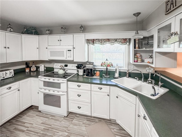 1912 Pleasant Ridge Rd, Virginia Beach, VA 23457 - kitchen featuring white appliances, white cabinets, and dark countertops