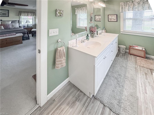 1912 Pleasant Ridge Rd, Virginia Beach, VA 23457 - bathroom with double vanity, wood finished floors, and ceiling fan