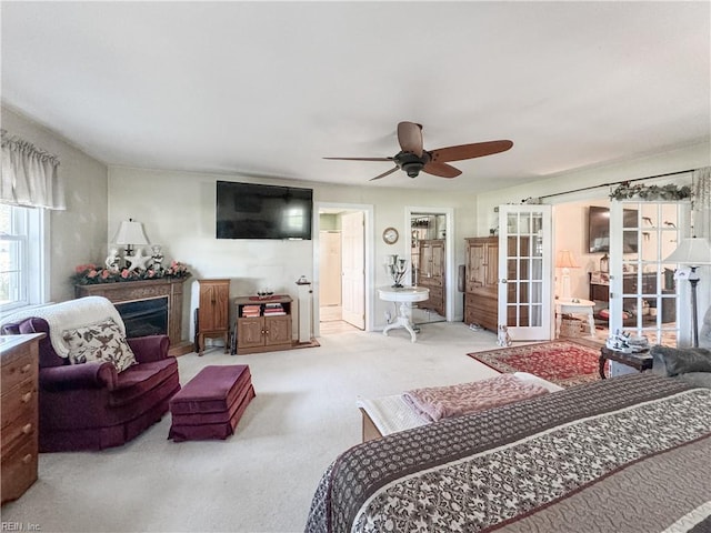 1912 Pleasant Ridge Rd, Virginia Beach, VA 23457 - carpeted bedroom with ensuite bathroom, french doors, a fireplace, and ceiling fan