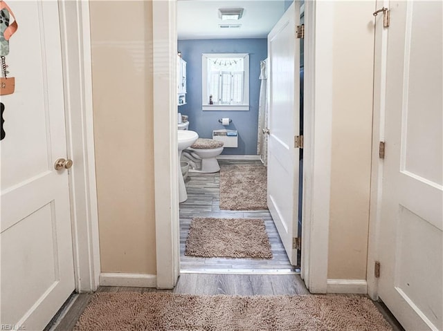 1912 Pleasant Ridge Rd, Virginia Beach, VA 23457 - bathroom featuring wood finished floors, a bidet, and a shower with shower curtain