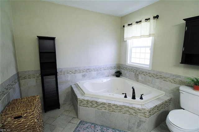 1353 King Arthur Dr, Chesapeake, VA 23323 - bathroom with tile walls, a jetted tub, and wainscoting