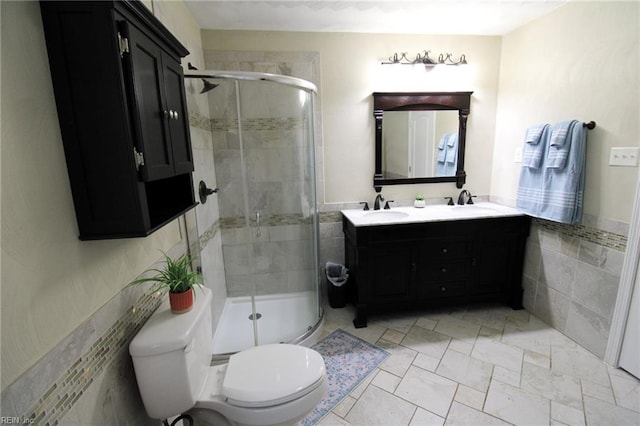 1353 King Arthur Dr, Chesapeake, VA 23323 - bathroom featuring double vanity, tile walls, and a stall shower