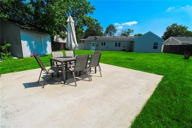 1353 King Arthur Dr, Chesapeake, VA 23323 - view of patio featuring outdoor dining space and an outbuilding