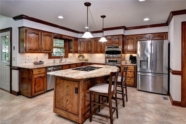 1217 Worthington Ln, Virginia Beach, VA 23464 - kitchen featuring stainless steel appliances, a center island, light stone counters, ornamental molding, and tasteful backsplash