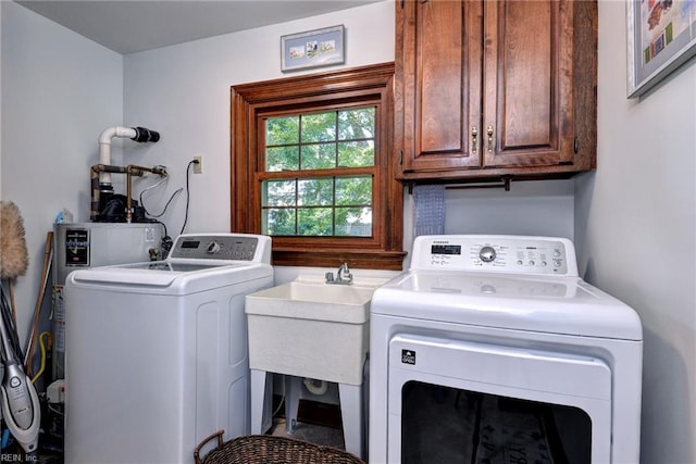1217 Worthington Ln, Virginia Beach, VA 23464 - laundry area with cabinet space and washing machine and clothes dryer