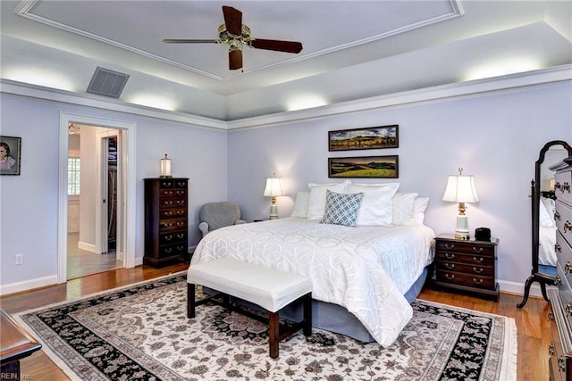 1217 Worthington Ln, Virginia Beach, VA 23464 - bedroom with a raised ceiling, wood finished floors, ceiling fan, and ornamental molding