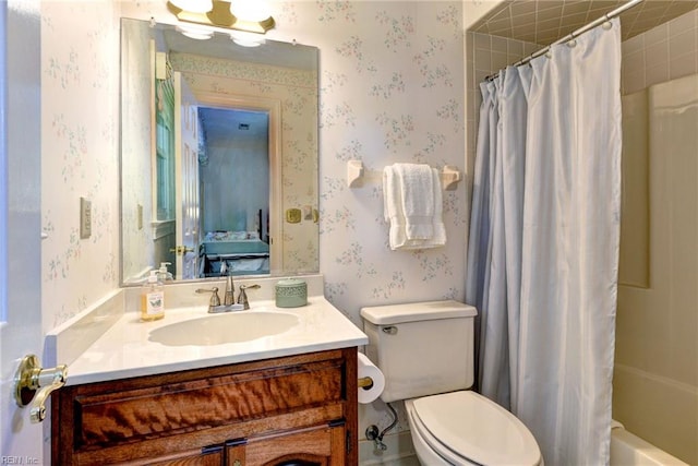 1217 Worthington Ln, Virginia Beach, VA 23464 - ensuite bathroom featuring wallpapered walls, vanity, and shower / bath combo with shower curtain