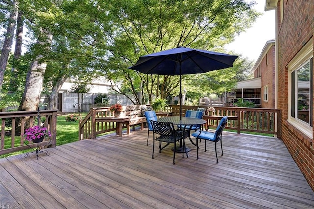 1217 Worthington Ln, Virginia Beach, VA 23464 - wooden deck with outdoor dining space and a fenced backyard