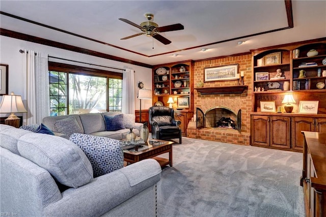 1217 Worthington Ln, Virginia Beach, VA 23464 - living room featuring light colored carpet, a ceiling fan, a fireplace, crown molding, and built in features