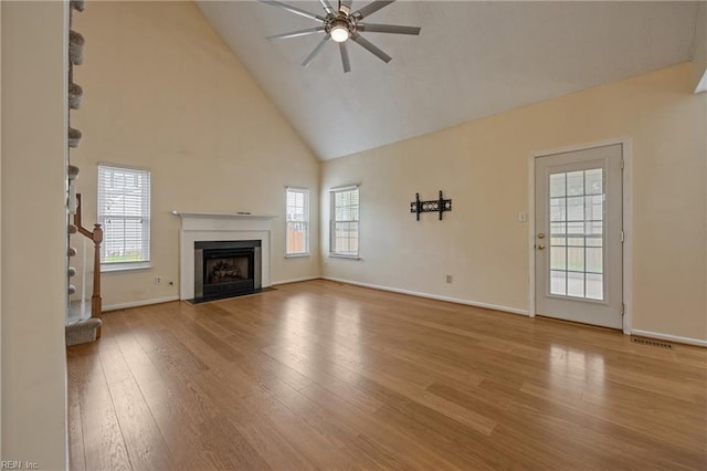 1301 Silverthorne Ct, Chesapeake, VA 23321 - unfurnished living room with ceiling fan, wood finished floors, high vaulted ceiling, plenty of natural light, and a fireplace with flush hearth