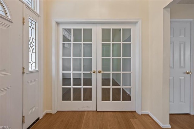 1301 Silverthorne Ct, Chesapeake, VA 23321 - entrance foyer featuring wood finished floors, french doors, and plenty of natural light
