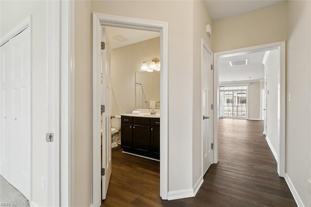 1402 Farringdon Way, Williamsburg, VA 23185 - hallway featuring dark wood finished floors and baseboards