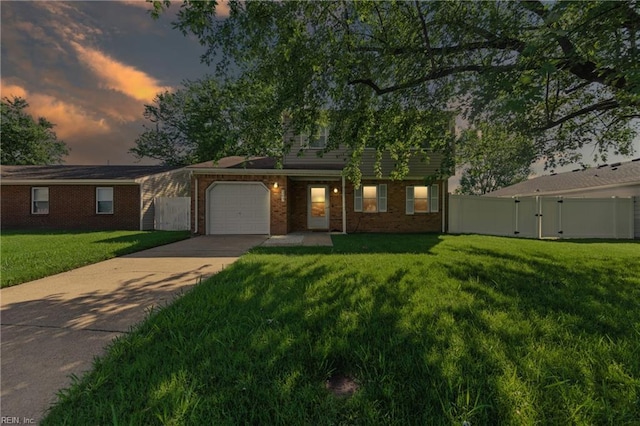 1217 Etworth Ln, Virginia Beach, VA 23464 - view of front of property featuring concrete driveway, a garage, a gate, and brick siding